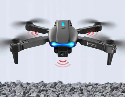 E99 dronas su 2 kameromis, „Wi-Fi“, aukščio palaikymu, kliūčių aptikimu, nuotolinio valdymo pultu ir dėklu
