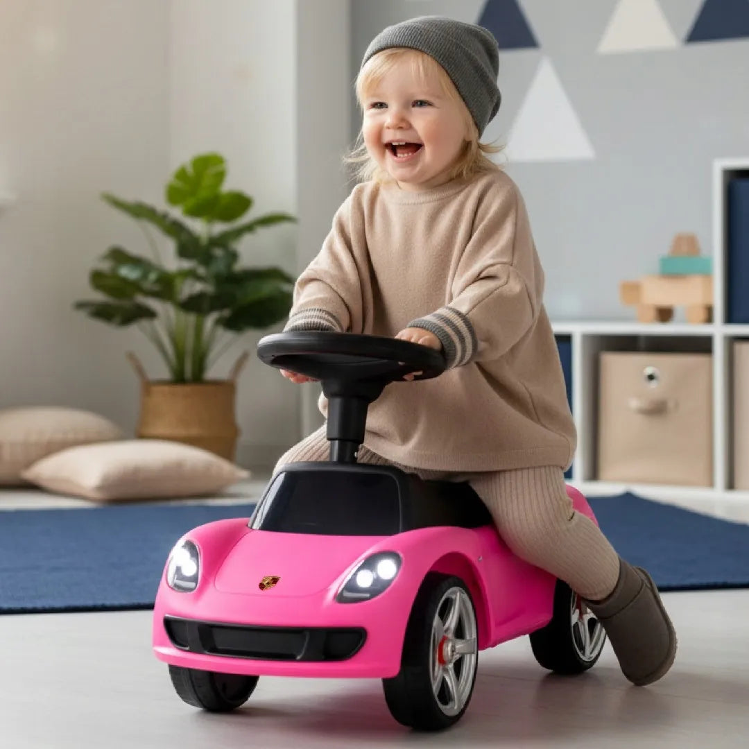 Rausvas vaikiškas pasispiriamas automobilis „Porsche Carrera GT“ su šviesomis